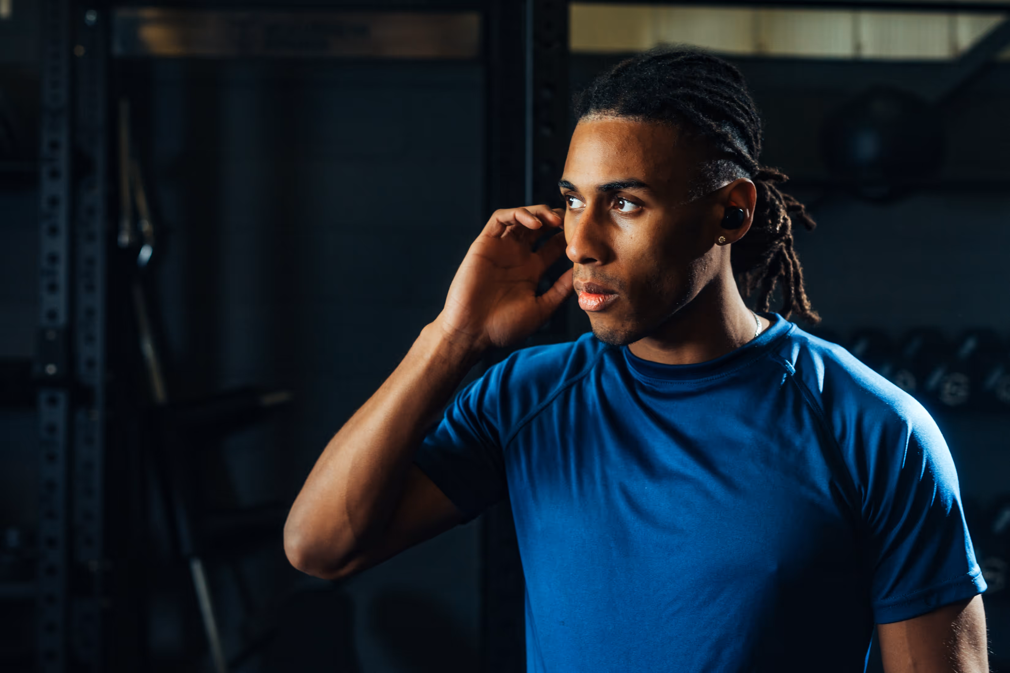 Athlete tapping earbud